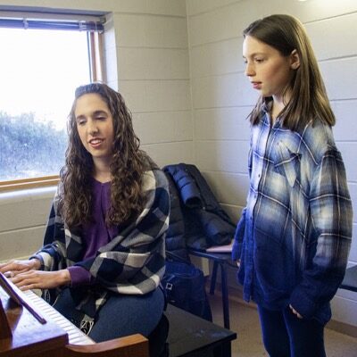 vocal music instructor Jamie Levine teaching a lesson to a vocal music student